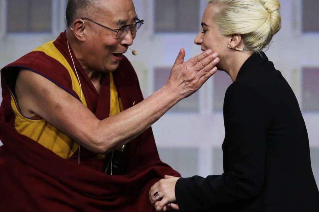 The Dalai Lama (left) greets Lady Gaga before they hold a question-and-answer session at the US Conference of Mayors in Indianapolis on Sunday. Photo: AP