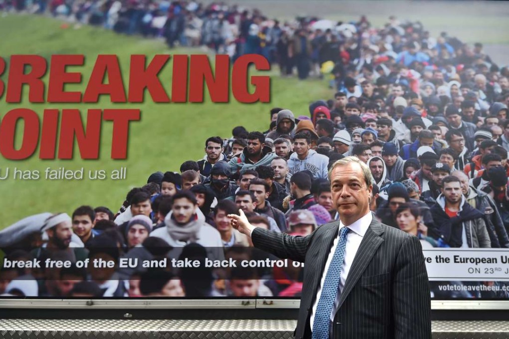Pro-Brexit campaigner Nigel Farage poses in front of a poster depicting a queue of refugees with the warning that Britain was being brought to “breaking point”. Photo: EPA