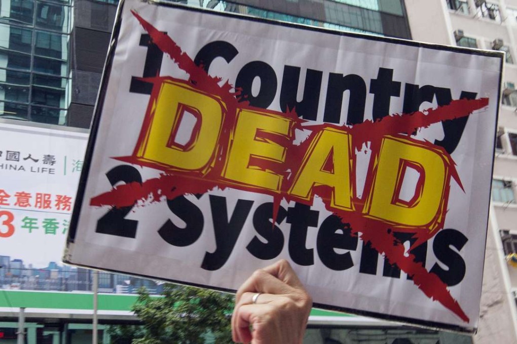 A protester opposed to the mainland government participates in a march through Hong Kong earlier this month in support of Lam Wing-kee. Photo: EPA
