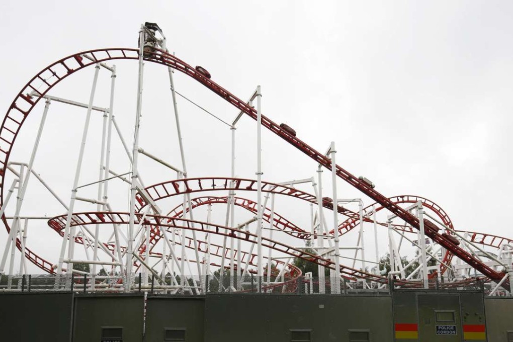 A police screen protects the site of a rollercoaster ride derailment at the M&D's amusement park in Motherwell, Scotland, on Sunday. Photo: AP