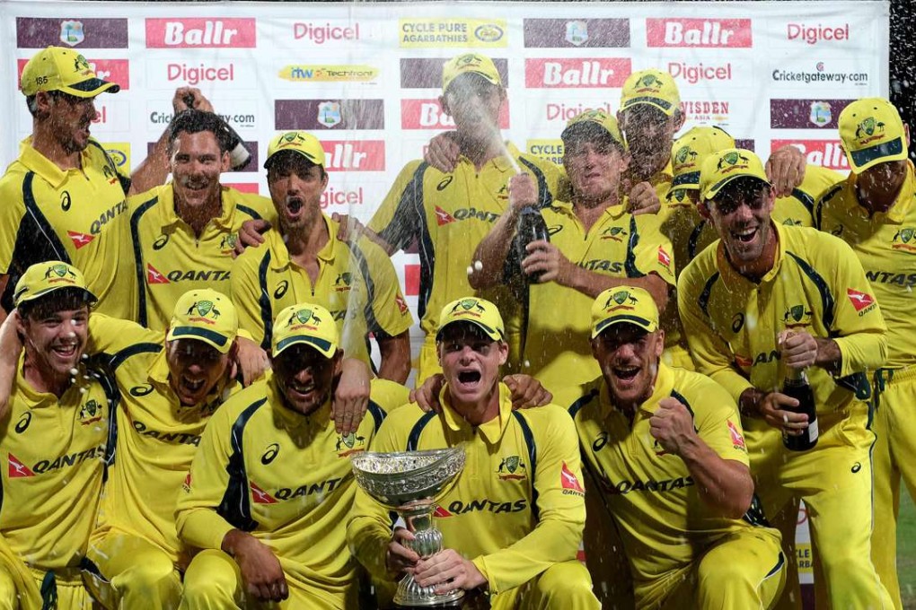 Australia pose with their winning trophy at the end of the final match of the tri-nation series. Photo: AFP