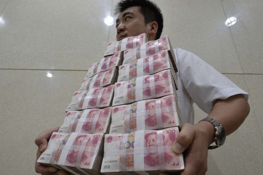 Bundles of 100 yuan bank notes at a bank in Taiyuan, Shanxi province. Many analysts say the true rate of non-performing loans at China’s banks could be as high as 20 per cent. Photo: Reuters