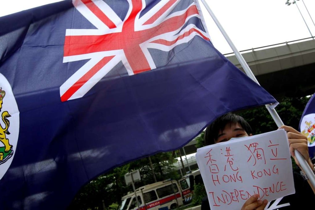 Hong Kong localists wave the colonial-era flag in front of the central government's liaison office in Western District. Photo: Dickson Lee