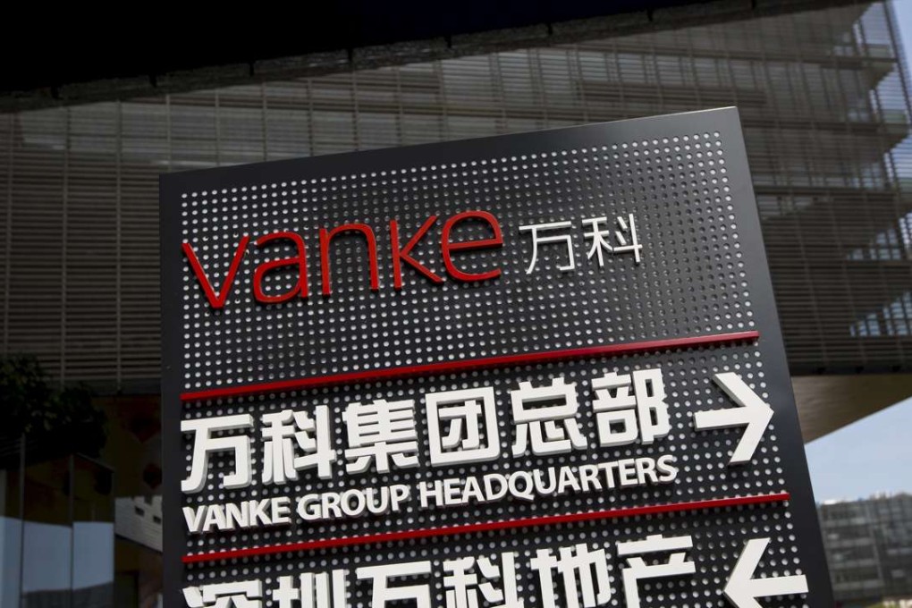Signs indicate the direction to Vanke group headquarters and Shenzhen Vanke Real Estate at its headquarters in Shenzhen. Photo: Reuters