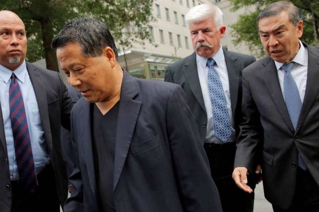 Macau real estate developer Ng Lap Seng second left), accused of bribing former United Nations General Assembly president John Ashe, exits USFederal Court in Manhattan on Monday. Photo: Reuters