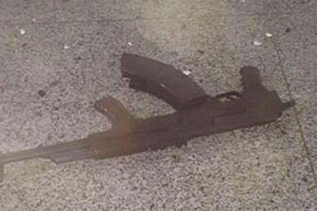 A weapon belonging to a dead suicide bomber lays on the floor at Ataturk airport. Photo: 140journo/Reuters