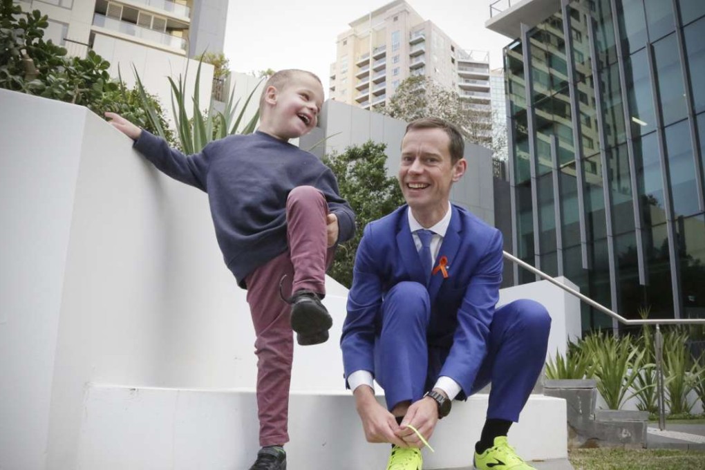 Mike Tozer, 35, and his son Josiah, five, who suffers from the genetic condition Fragile X, in Sydney. Photo: Daniel Marr