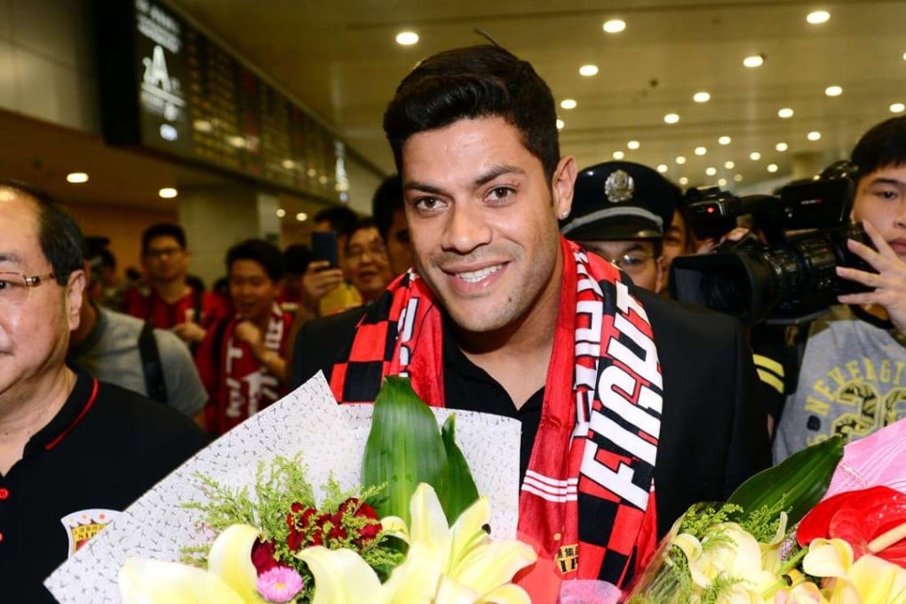 Brazil's Hulk makes his way through the arrivals halls at Shanghai Pudong International Airport. Photo: AFP