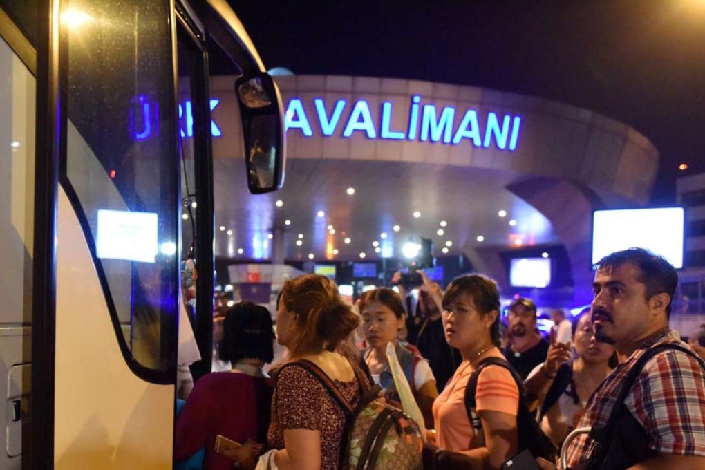 Stranded passengers are transferred to nearby hotels from Ataturk International Airport in Istanbul, Turkey, after suicide attacks . Photo: Xinhua