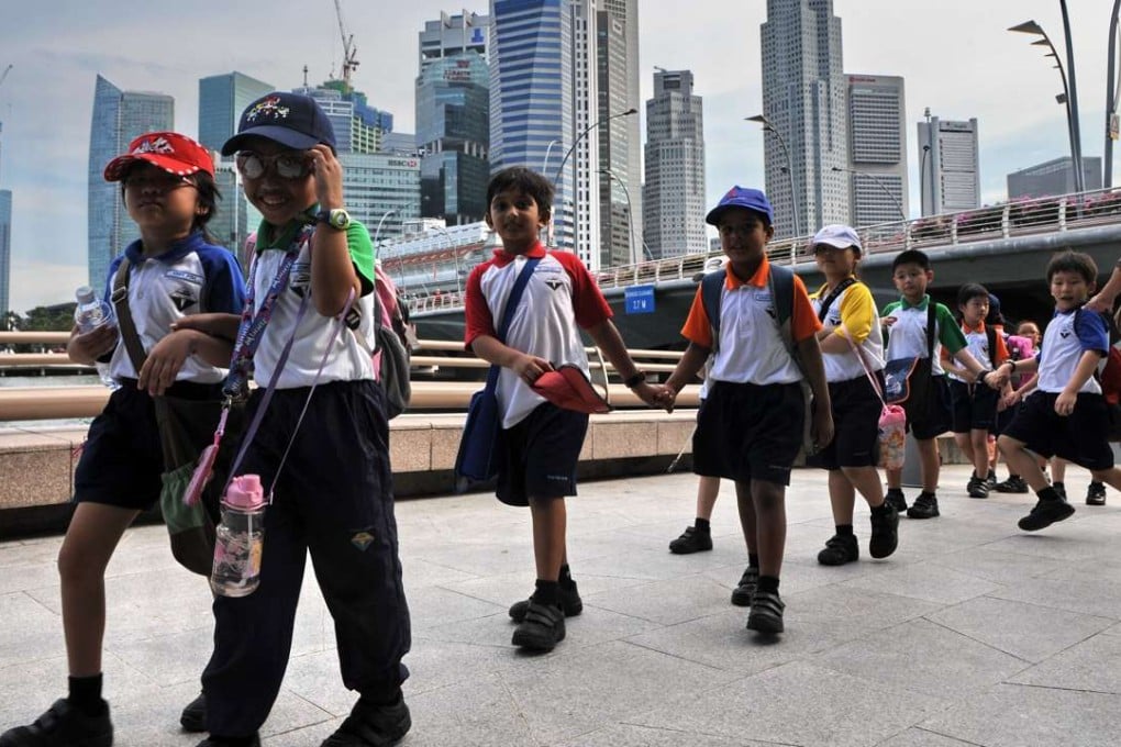 Schoolchildren in Singapore. A new study of parenting techniques in the city has discovered problems with overly intrusive parenting. Photo: AFP