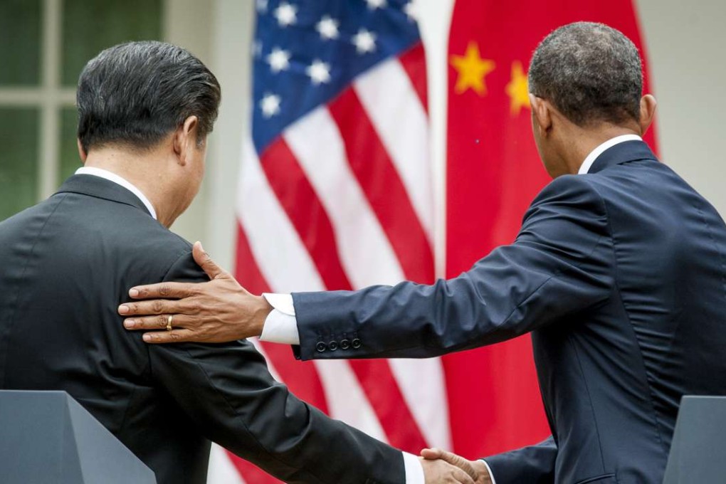 Xi Jinping and Barack Obama shake hands after a joint news conference in the Rose Garden at the White House last September, when the US and China announced agreement on broad anti-hacking principles aimed at stopping the theft of corporate trade secrets. Photo: Bloomberg