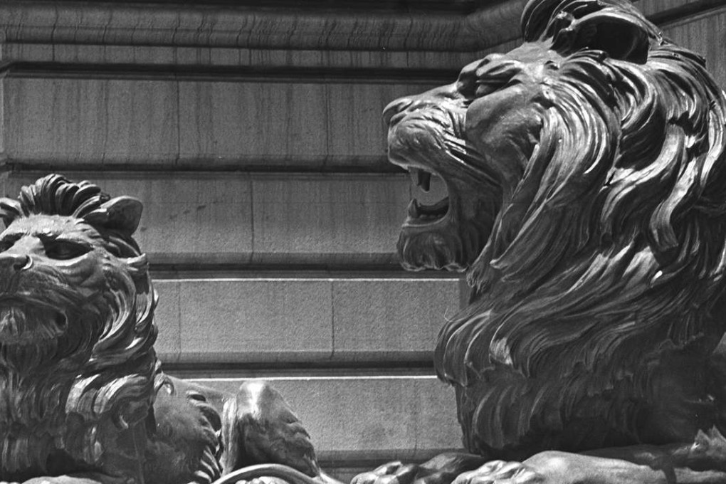 The bronze lions guarding the HSBC headquarters in Central still bear war wounds from 1941.
