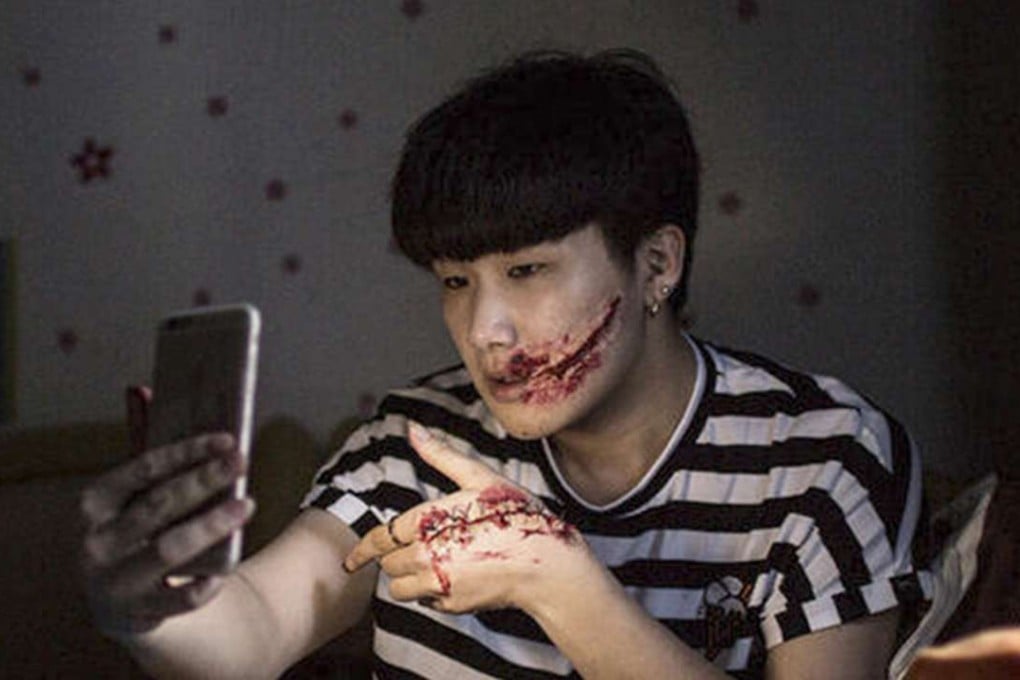 Scarface: Xiao Xia, who specialises in creating lifelike injuries with stage make-up, has half a million followers and a bag of advertising contracts. Photo: Qq.com