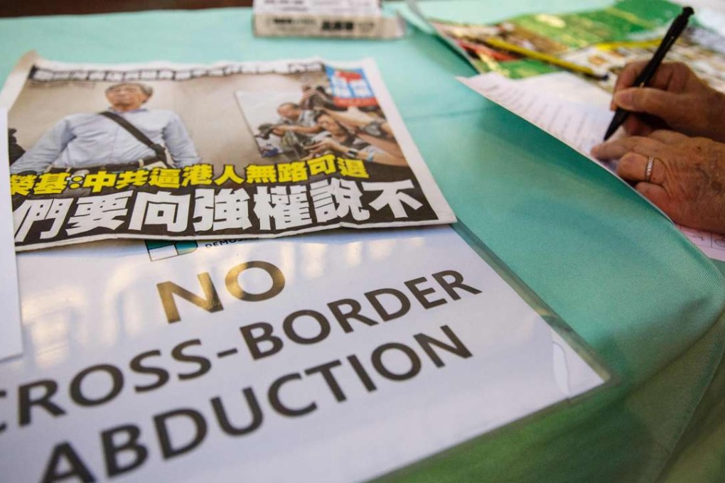 A placard displayed next to a petition set up by pro-democracy political group Demosisto in support of freedom of press and speech and for the missing and returned booksellers outside the Causeway Bay Books store in Hong Kong. Photo: AFP