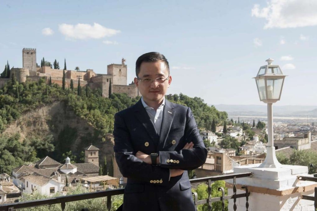 New president of Spanish Primera Liga club Granada CF, Jiang Lizhang, poses for the local media. Photo: EPA
