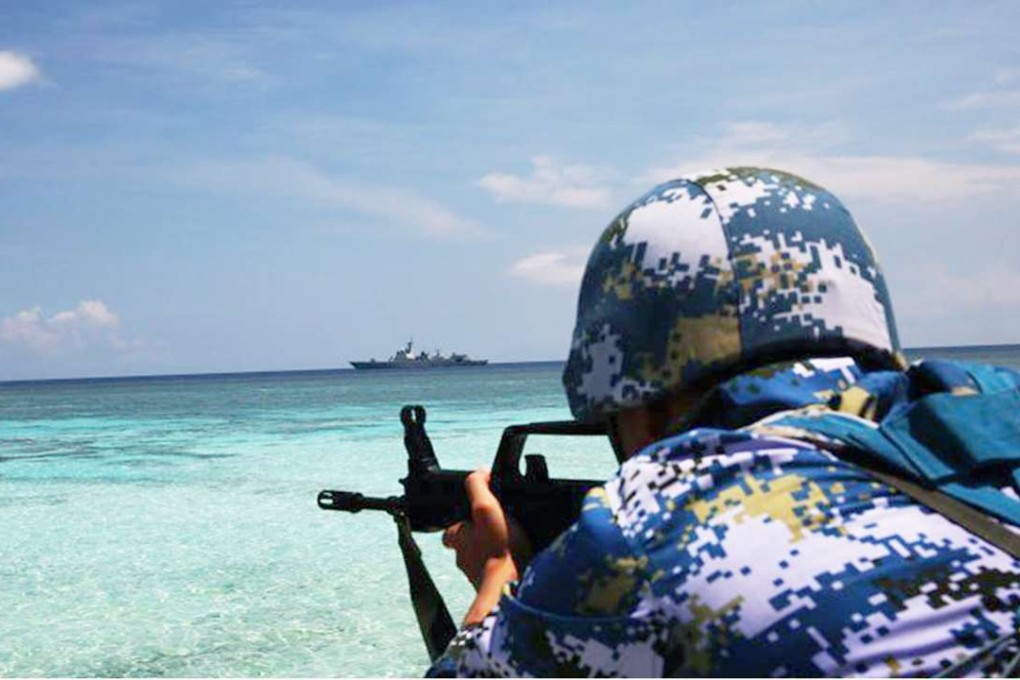A Chinese soldier takes aim during a military drill in the South China Sea. Photo: SCMP Pictures