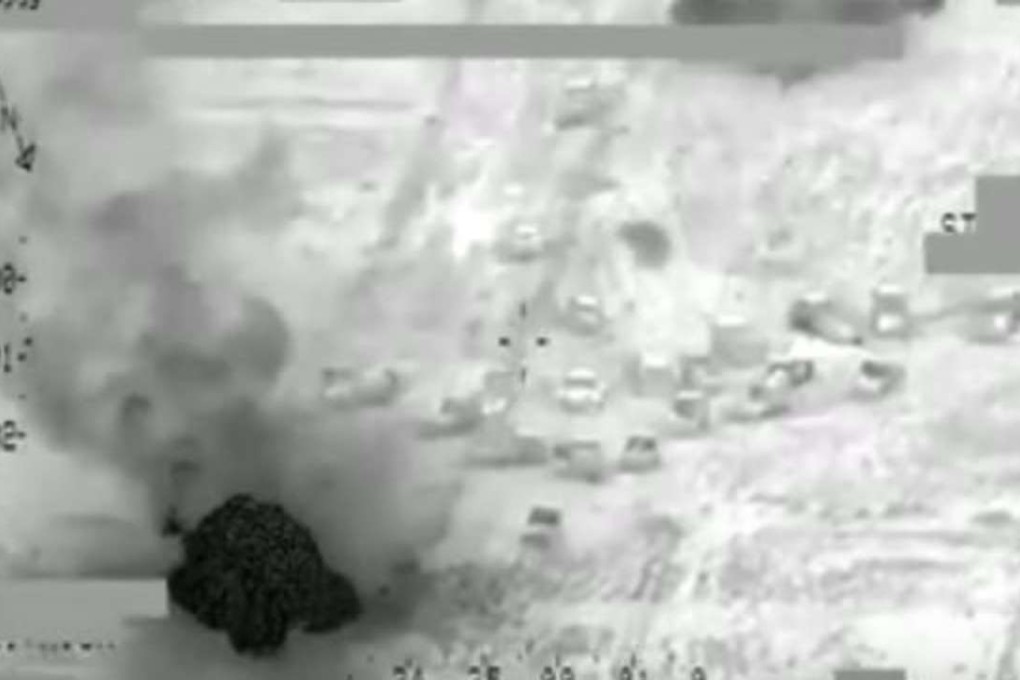 This still image taken from a US military video shows a US airstrike against a suspected Islamic State convoy outside Fallujah in Iraq on Wednesday, June 29. The strike is said to have killed 250 Islamic State fighters and destroyed 40 vehicles. Photo: ABC News / US military handout