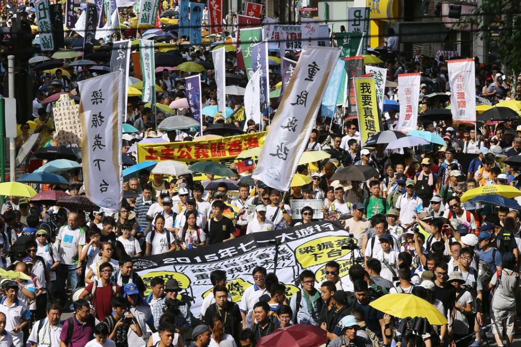 The July 1 march passes through Causeway Bay in 2015. Photo: Sam Tsang