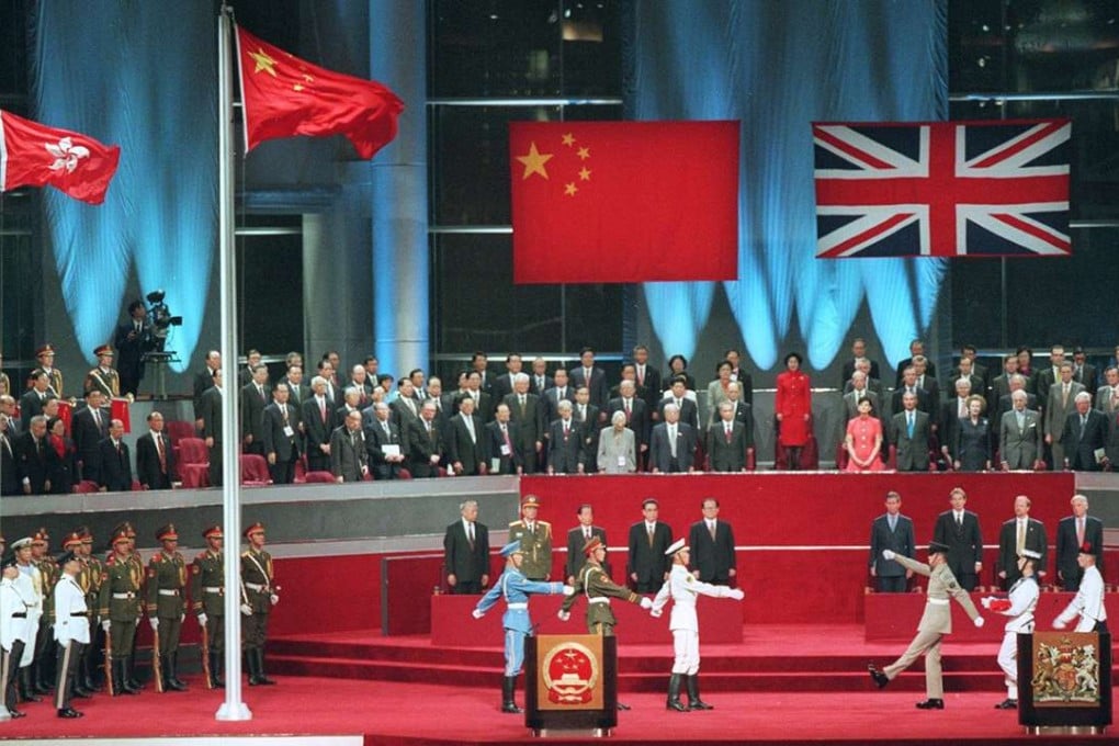 The handover in 1997, when the British flag was lowered followed by the raising of the Chinese and Hong Kong flags. Photo: Robert Ng