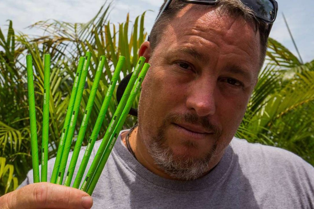 Campaigner Gary Stokes holds up some of his paper straws. Photo: SCMP Pictures