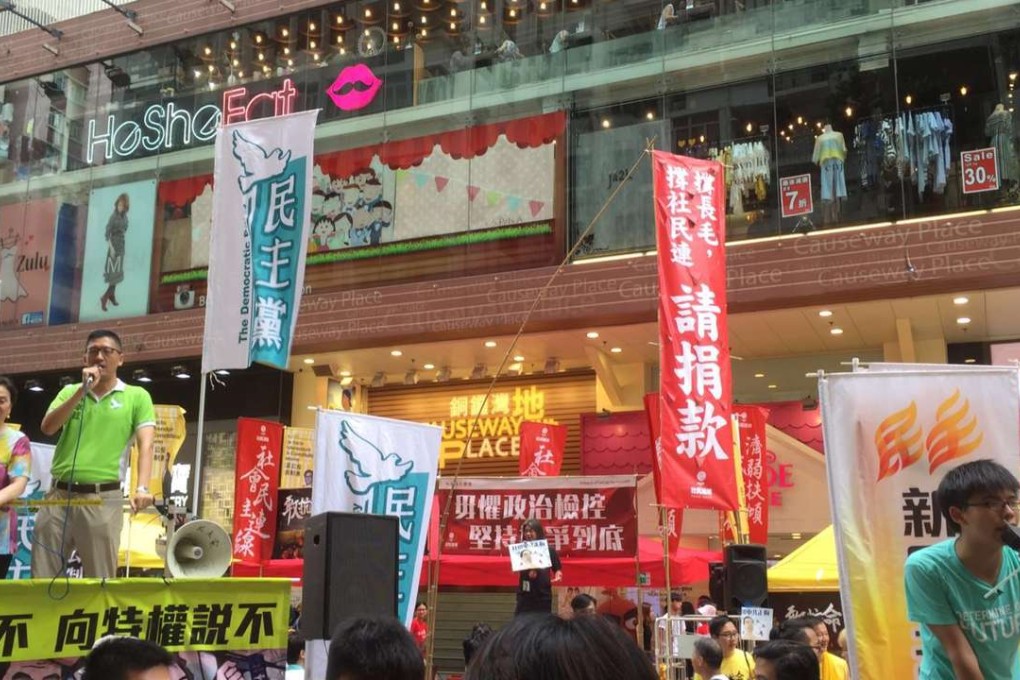 Demosisto secretary general Joshua Wong (right) was at the march in Fashion Walk, Causeway Bay. Photo: Shannon Cho