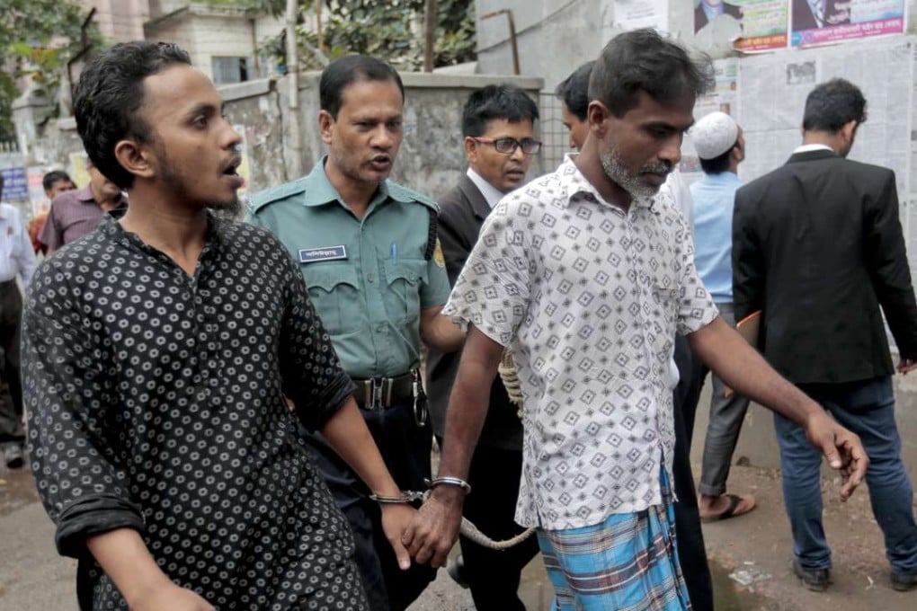 Bangladeshi men detained as part of crackdown on Islamic extremists are escorted by policemen in Dhaka. Photo: AP