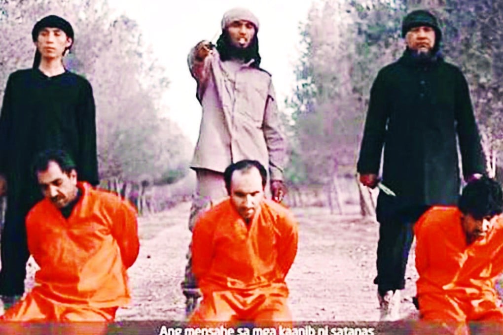 A screenshot from the IS video with Malaysian jihadist Mohd Rafi Udin standing on the right. Photo: SCMP Pictures