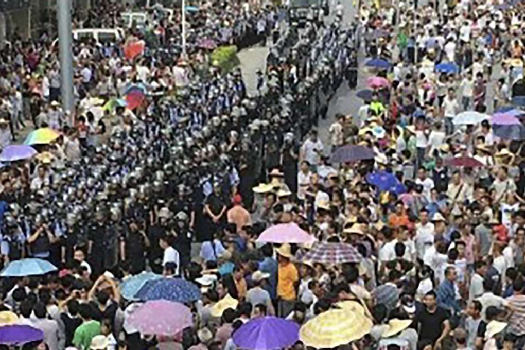 Residents of Lubu township in Guangdong province take to the streets to protest against plans for an incinerator project. Photo: SCMP Pictures