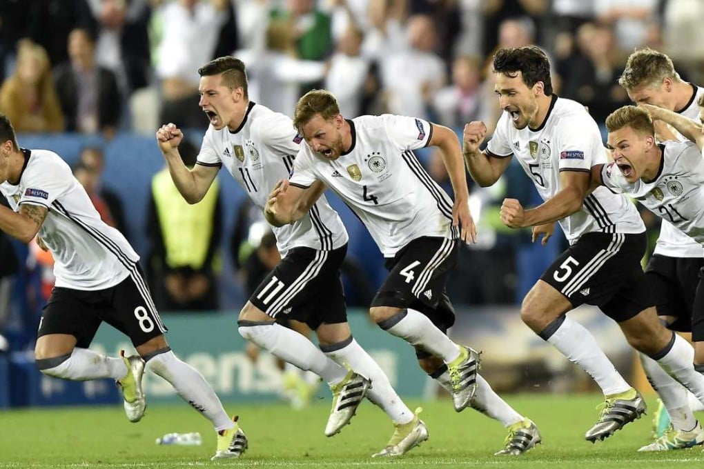 German players celebrate after winning 6-5 in the penalty shoot-out. Photo: EPA