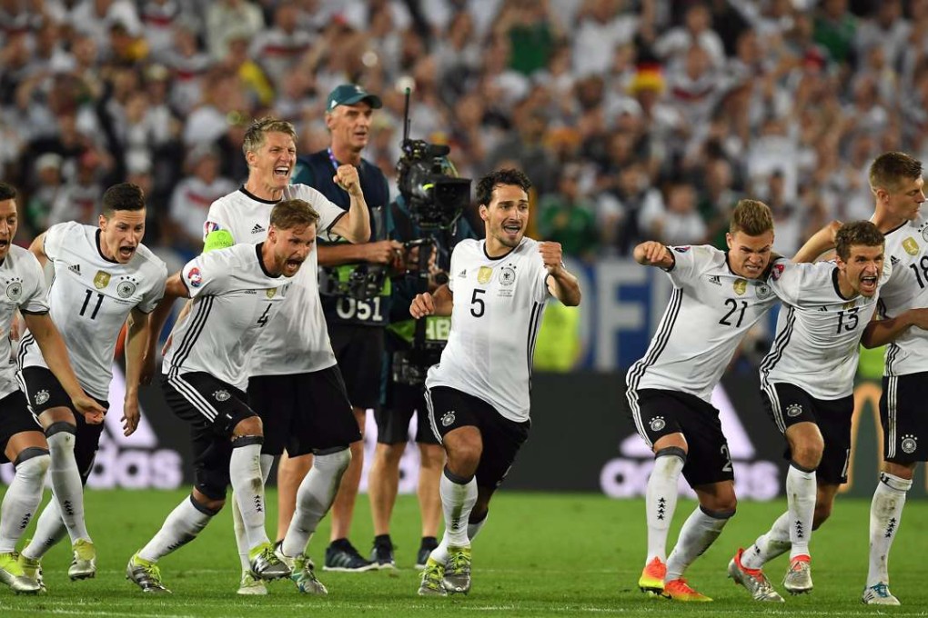 Germany players react after winning the penalty shoot-out EPA