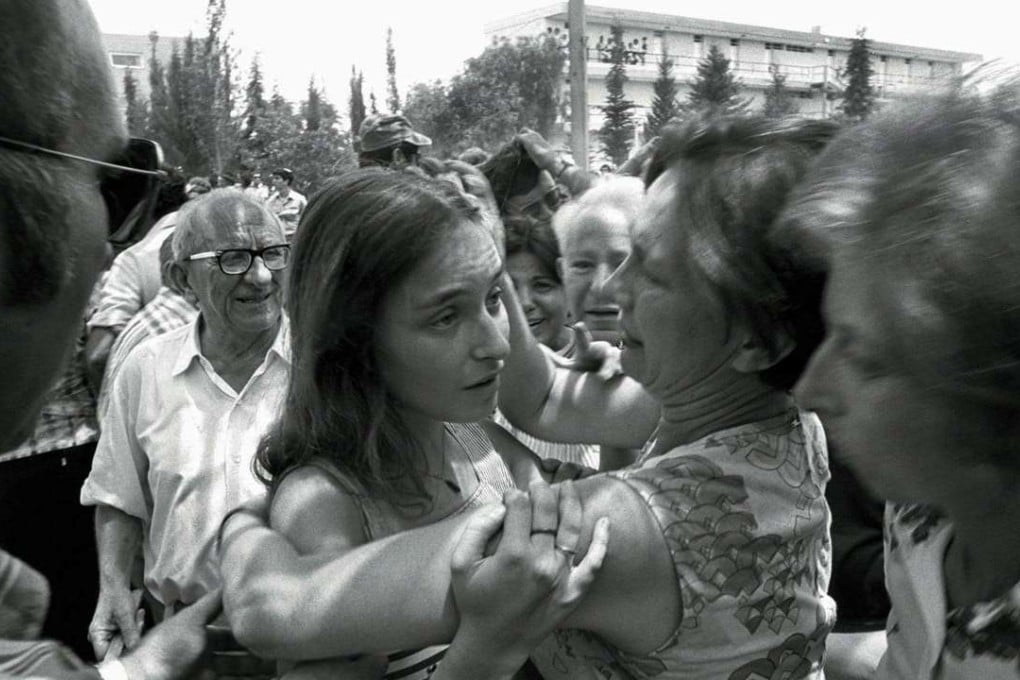 An Israeli family reunion at Ben Gurion Airport after the Israeli raid on a hijacked Air France plane that had been flown to Entebbe, Uganda. Israeli commandos freed 100 hostages held by Palestinian hijackers in a daring operation. Photo: Reuters