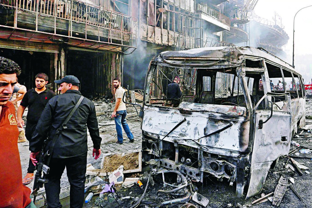 Iraqi policemen inspect the site of suicide car bomb attack in the Karada district of central Baghdad, Iraq, 3 July, 2016. Photo: EPA