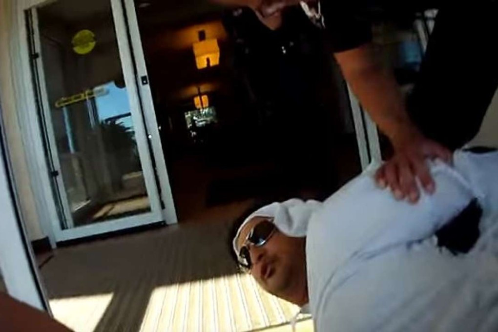 Medical tourist Ahmed al-Menhali, from the UAE, is detained at gunpoint on June 29, 2016, in Avon, Ohio, after a suspicious hotel clerk alerted relatives, who called 911. Menhali was wearing flowing white robes common in his home country. Photo: Avon PD / News Channel 5