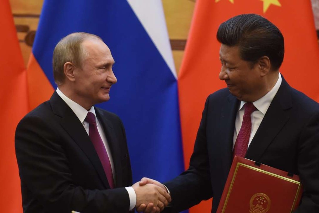 Russian President Vladimir Putin (L) with his Chinese counterpart Xi Jinping. Photo: EPA