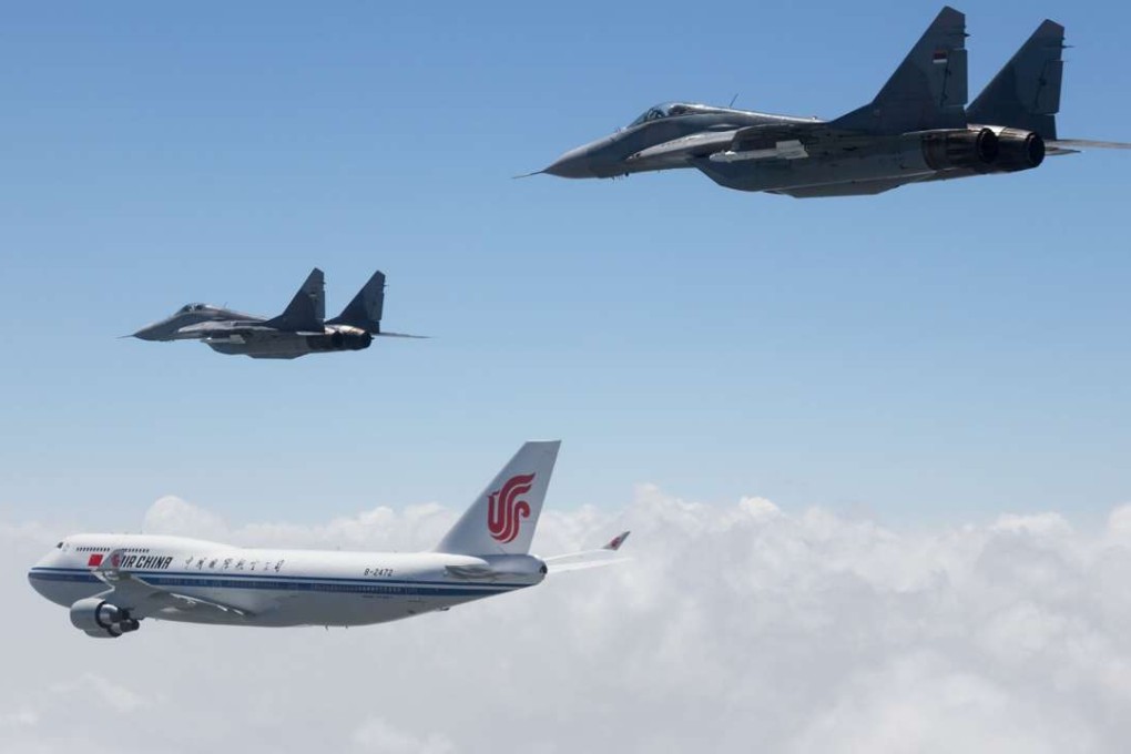 Serbian Air force MIG 29 fighter planes escorting China’s Presidential Boeing 747 with President Xi Jinping on board before landing at Belgrade airport on June 17, 2016 . Photo: AFP