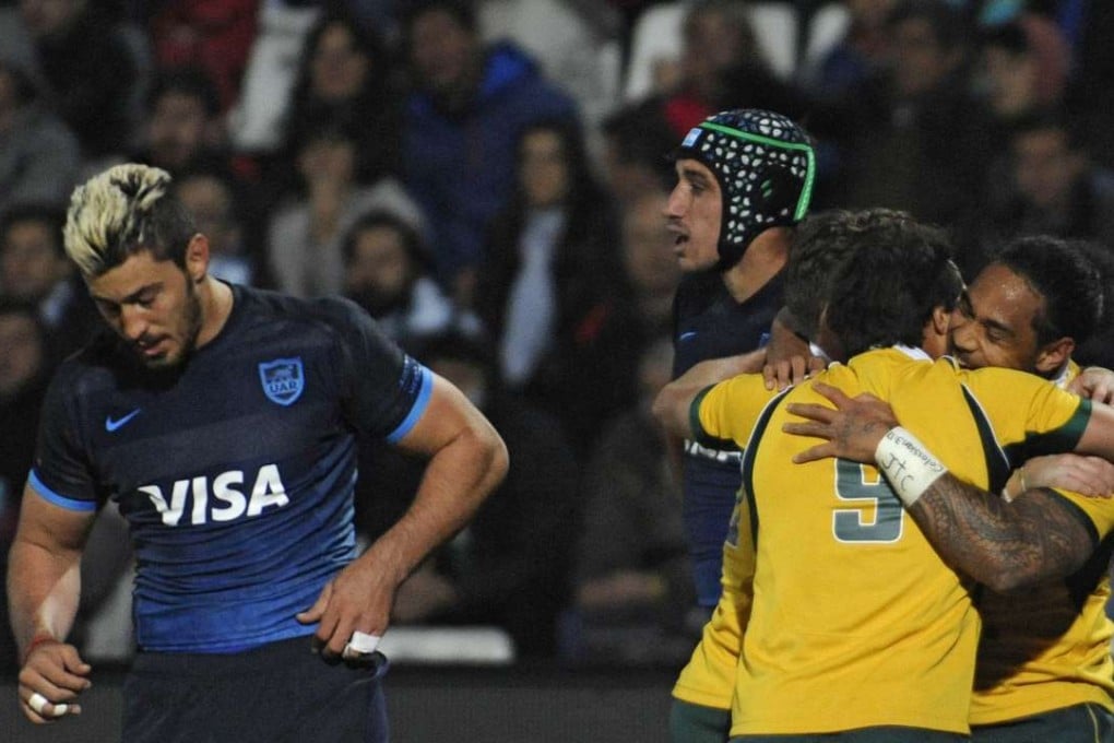 Australia's Joe Tomane celebrates with team-mates after scoring a try against Argentina during the 2015 Rugby Championship. Photo: AFP
