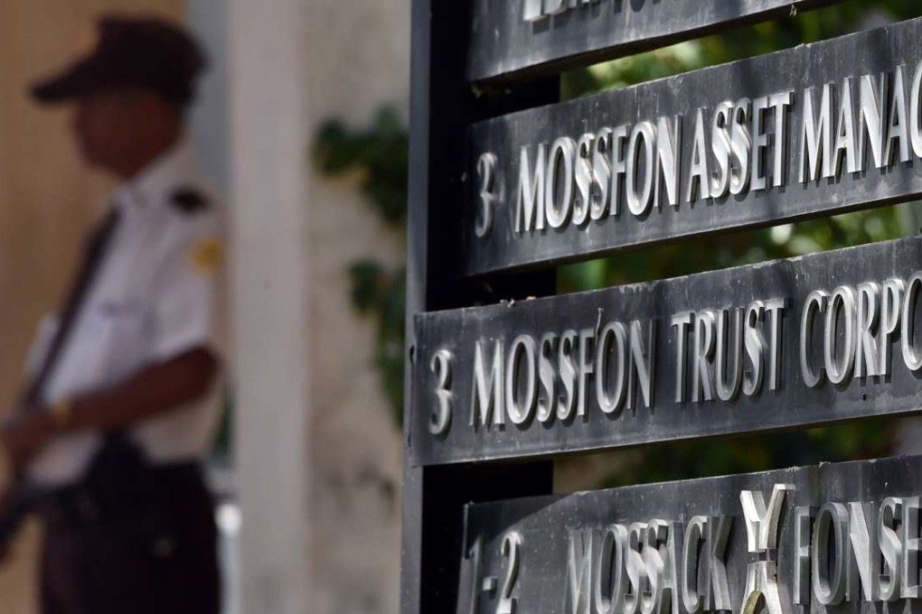 A private security guard stands outside the building where Panama-based Mossack Fonseca law firm is based, in Panama City, on April 5, 2016. A massive leak - coming from Mossack Fonseca - of 11.5 million tax documents exposed the secret offshore dealings of world leaders, celebrities and institutions. Photo: AFP