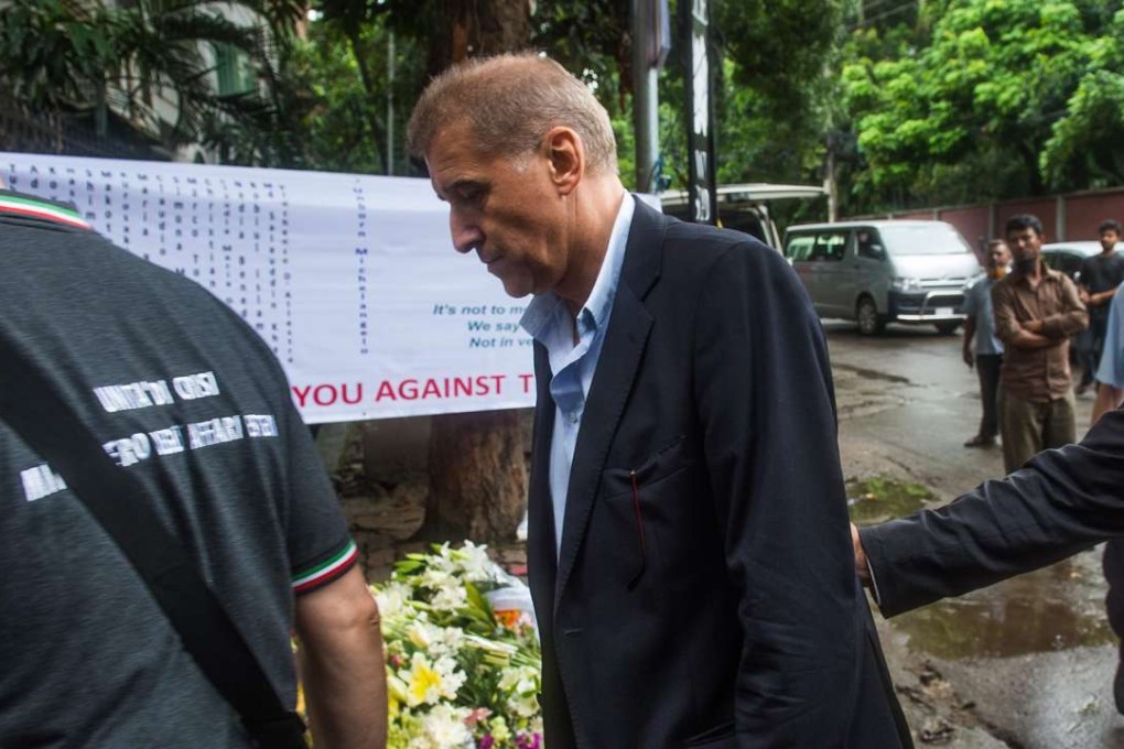 Italian businessman Gianni Boschetti (centre) had stepped out of a Dhaka cafe to speak on his mobile moments before the restaurant was stormed by Islamists. Photo: AFP