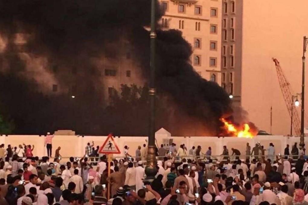 Muslim worshippers gather after a suicide bomber detonated a device near the security headquarters of the Prophet's Mosque in Medina, Saudi Arabia on July 4. Photo: Reuters