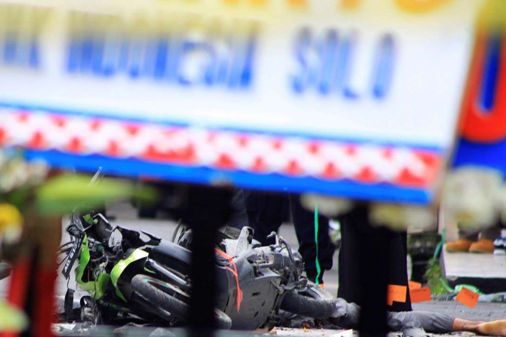 The body of the suicide bomber lies next to his motorbike after a failed attempt to strike a police station in Solo, Indonesia. Photo: Antara/Reuters