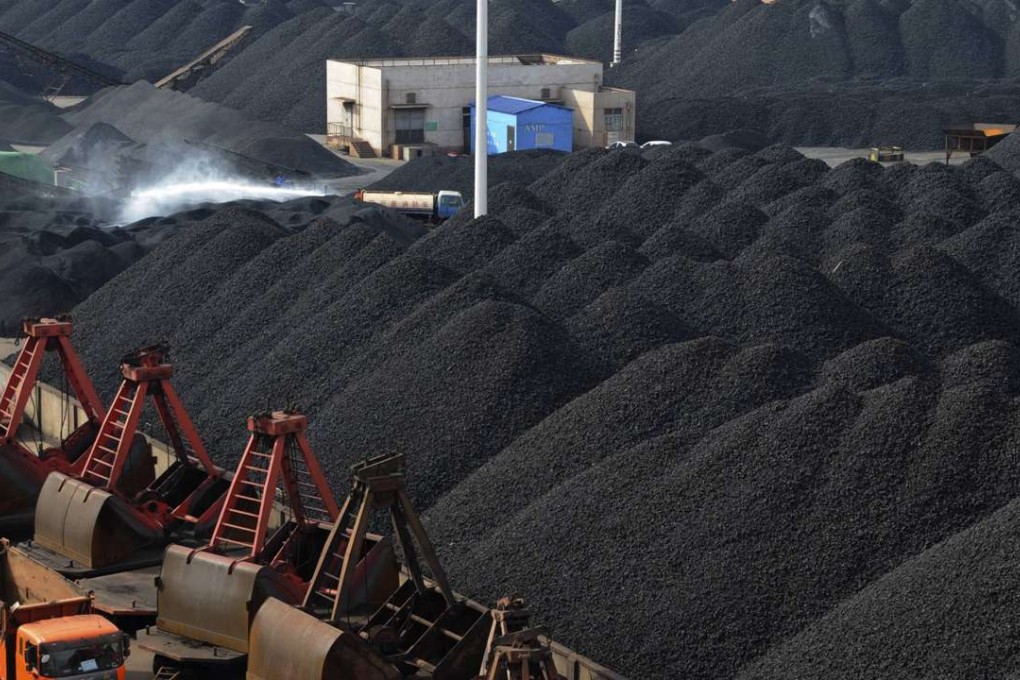 Coal ready for loading at Lianyungang port in Jiangsu province. Inventories have been reduced across the country, resulting in a 4 per cent spike in domestic prices in June. But analysts predict the rise is only temporary. Photo: Reuters