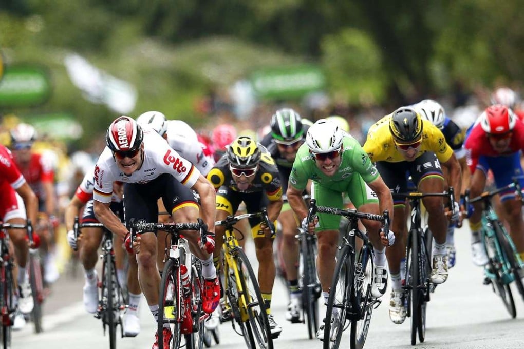 British rider Mark Cavendish (centre, right) sprints to win the third stage of the Tour de France from German rider Andre Greipel (centre, left). Photo: EPA