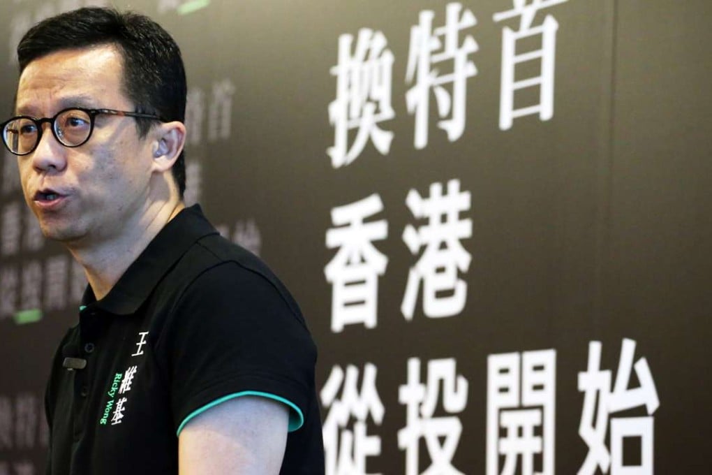 Ricky Wong discusses his election plans at a press conference at Regus Business Centre in Wan Chai. Photo: Felix Wong