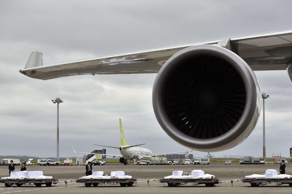 Caskets of 7 Japanese nationals killed in a terrorist attack in Dhaka are seen on the tarmac at Haneda airport in Tokyo. Photo: EPA