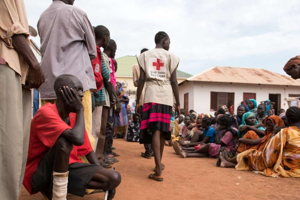 Displaced persons wait in a South Sudan Red Cross compound in Wau last Friday. Photo: AFP