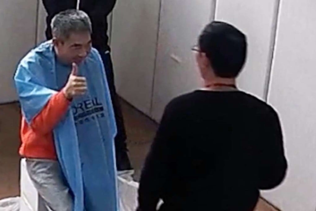 Lam in the video flashing a thumbs-up sign during his detention on the mainland. Photo: SCMP Pictures