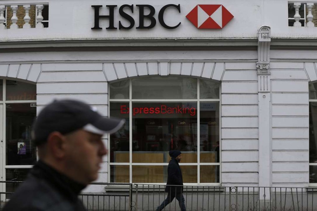 People walk past a branch of the HSBC bank in London. Return on equity at the lender has been in a slump for eight consecutive years. Photo: AP