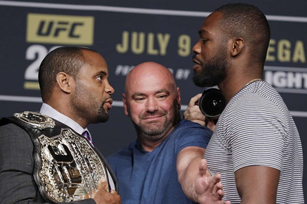 Dana White stands between Daniel Cormier (left) and Jon Jones during a UFC 200 press conference on July 6. Photo: AP