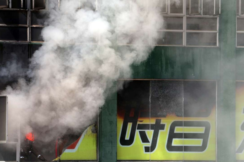 The flames take hold at Amoycan Industrial Centre on Ngau Tau Kok Road on June 21. Two firefighters died in the blaze, and more than 200 mini-storage cubicles were destroyed. Photo: Felix Wong, SCMP