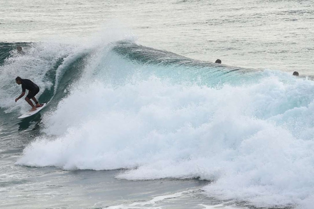 Surfers riding waves at Boulders Beach in Ballina, Australia. Photo: AFP